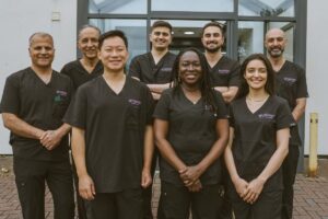 Group of dentists at Lodge Causeway Dental Centre outside the dental practice in Fishponds, Bristol