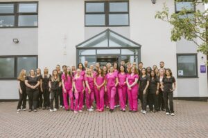 Lodge Causeway Dental Centre team standing together outside the practice in Fishponds, Bristol