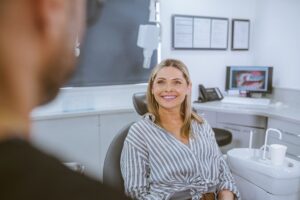 Patient discussing dental implant treatment with a dentist during a consultation at Lodge Causeway Dental Centre in Bristol