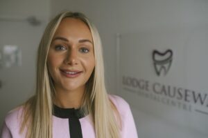 Lodge Causeway Dental Centre team member supporting patients through their dental implant consultation and treatment journey