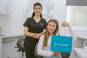 Patient receiving her Invisalign aligners from her dentist at Lodge Causeway Dental Centre in Bristol