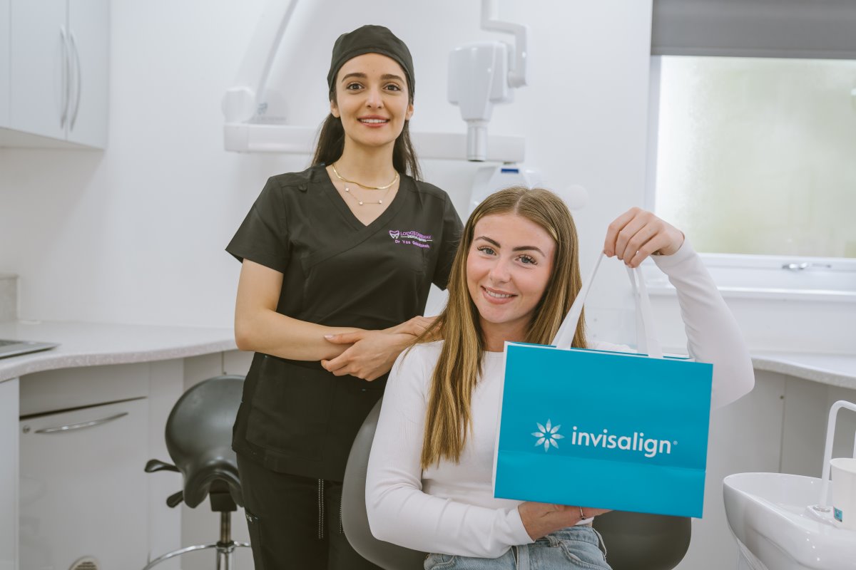Patient receiving her Invisalign aligners from her dentist at Lodge Causeway Dental Centre in Bristol