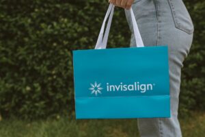 Close-up of an Invisalign treatment bag being carried after clear aligner collection