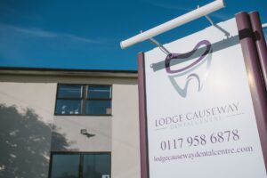lodge causeway dental centre building front view with Logo and info on board